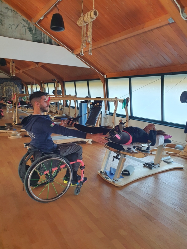 Lorenzo Spadafora, a GYROTONIC® Trainer with a spinal cord injury, practicing and teaching from a wheelchair. 