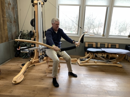 A man using the GYROTONIC® Wingmaster 