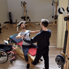 Igor Abba teaching the GYROTONIC® Method to a paraplegic man with a spinal cord injury