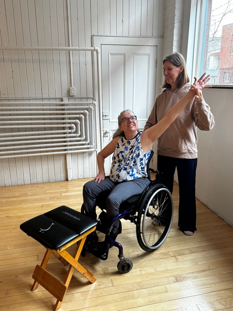 Liz Winkelaar, a licensed trainer, training with a chair and the GYROKINESIS® method from a wheelchair