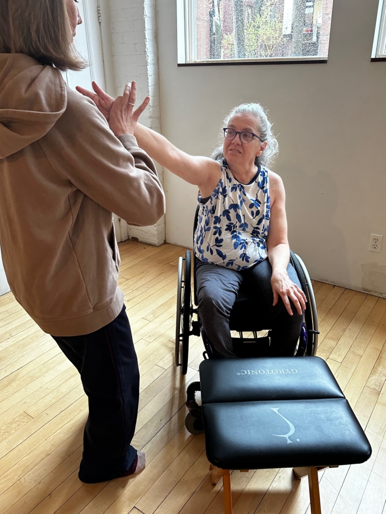 Liz Winkelaar, a licensed trainer, training with the GYROKINESIS® method from a wheelchair