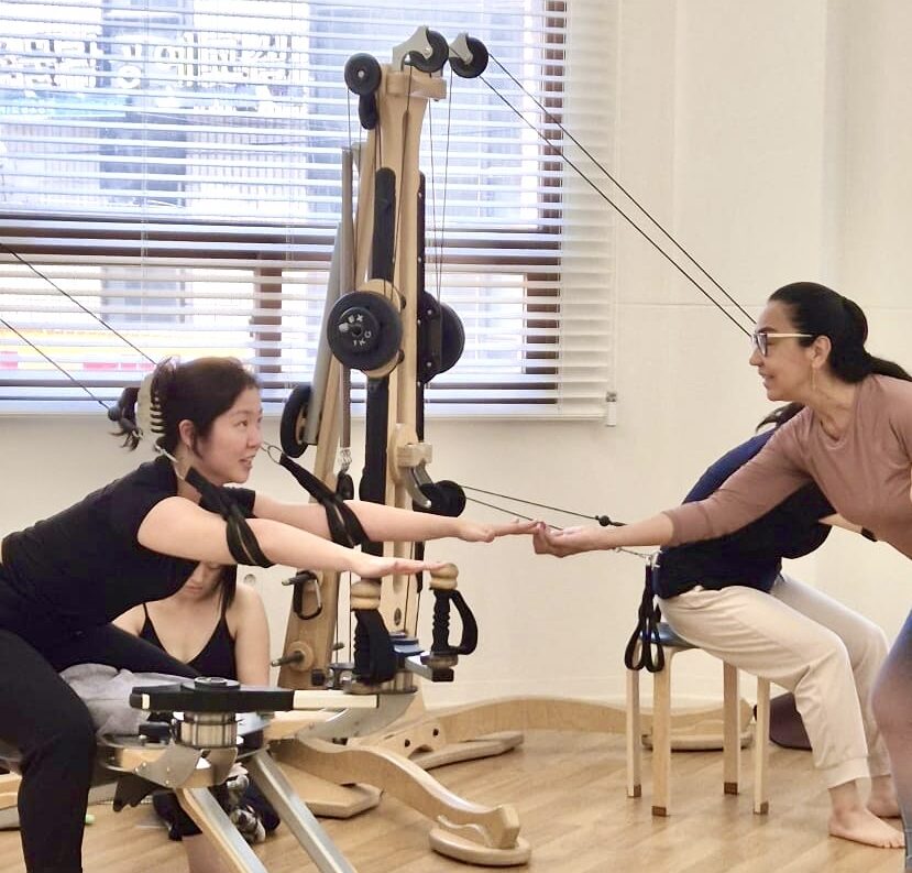 GYROTONIC® Trainer Rita Renha working with a client