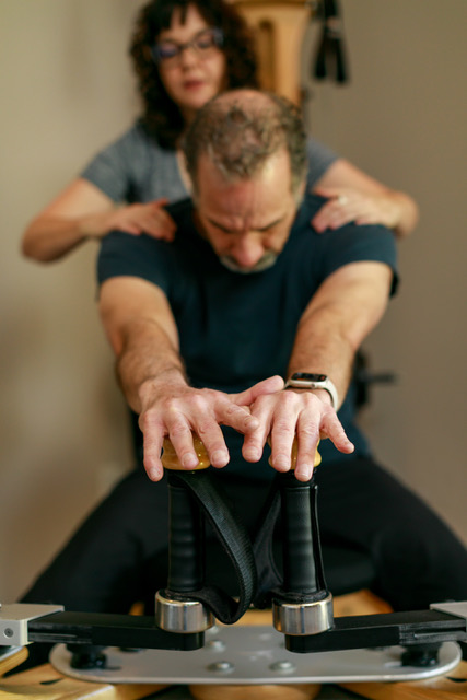 GYROTONIC® Trainer Kate Pagliasotti working with a client, demonstrating the benefits of understanding Polyvagal Theory